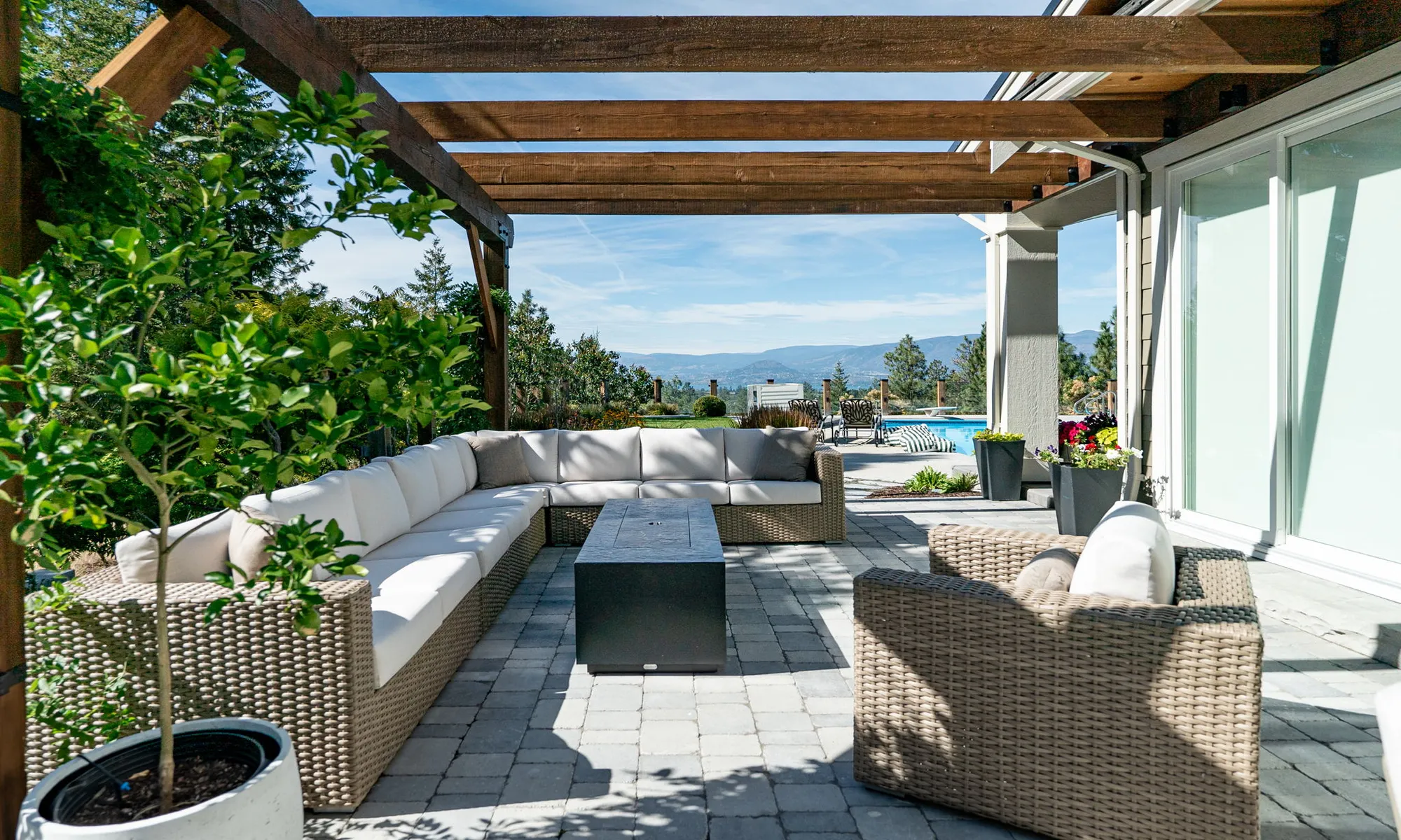couches and progola and greenery and paver stones
