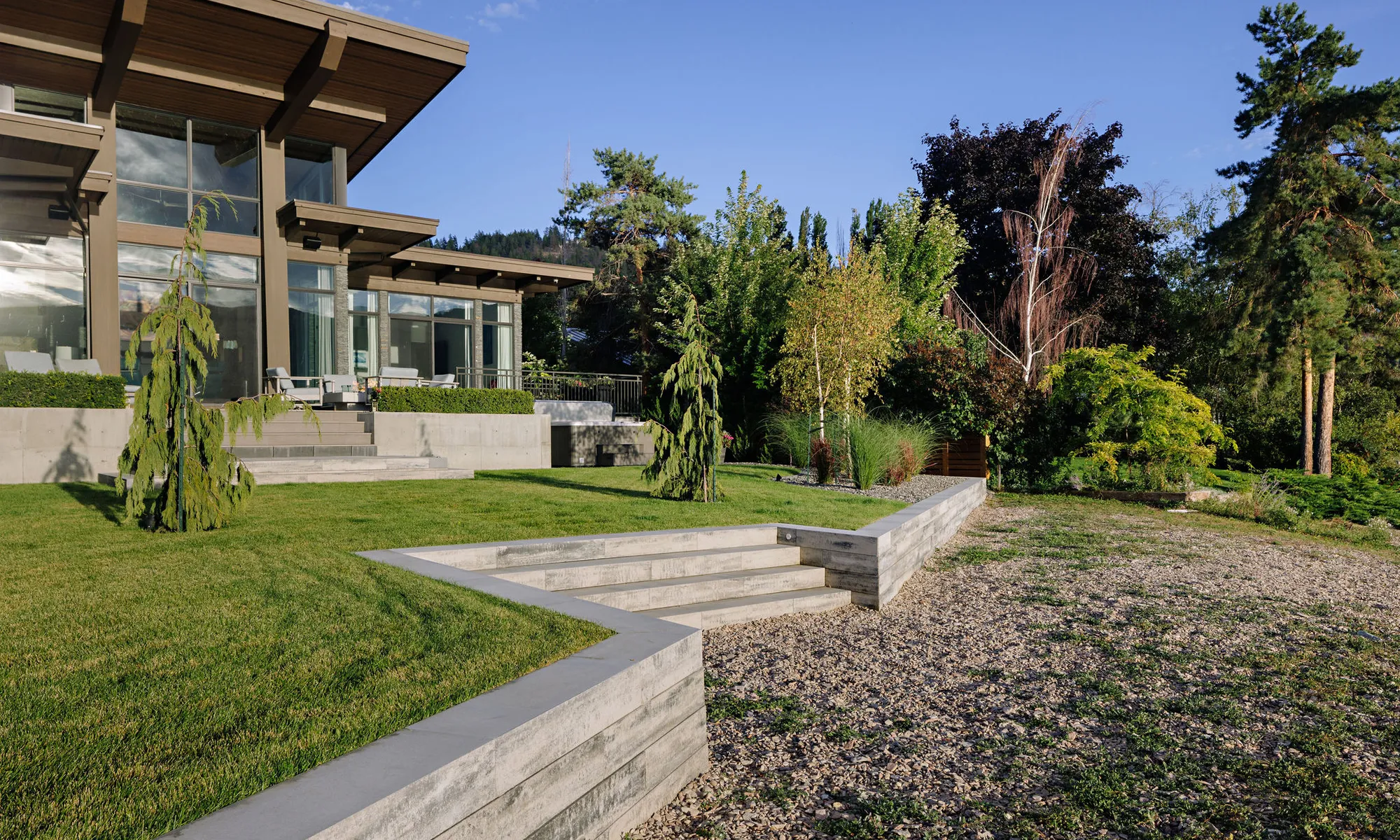 retaining wall and stairs and trees modern home