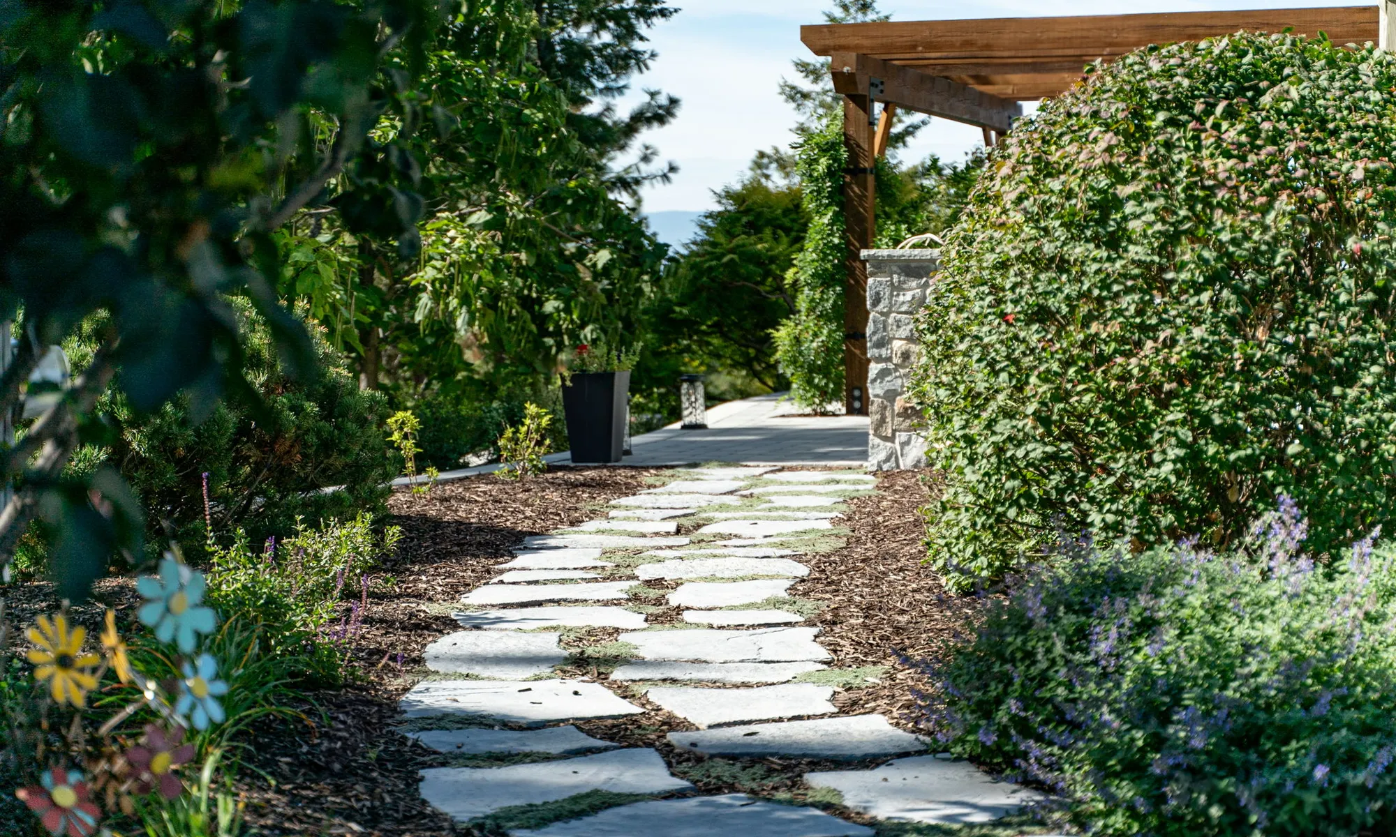 walkway paver stones and shrubs and flowers