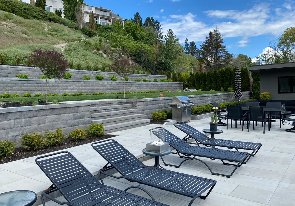 chairs and retaining wall fixture with paver stone flooring