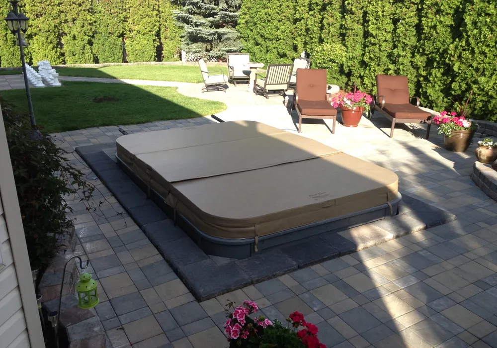 hot tub with stone floor and edging