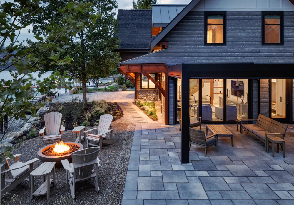 modern home and firepit and stone walkway