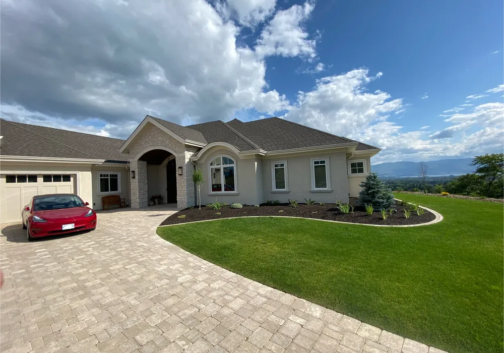 paver stone driveway with tesla