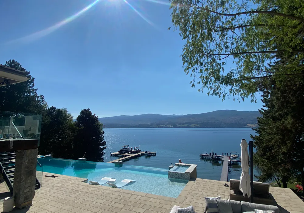 pool and lake front property view