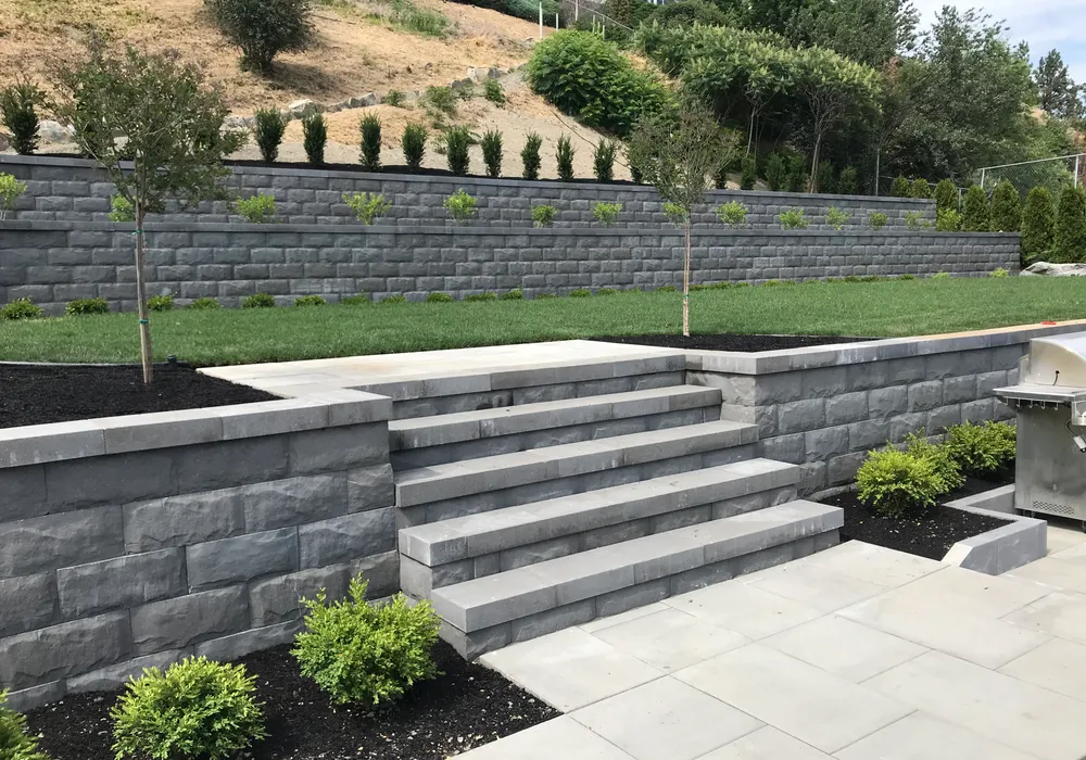 retaining wall with steps stone and green grass multi layer