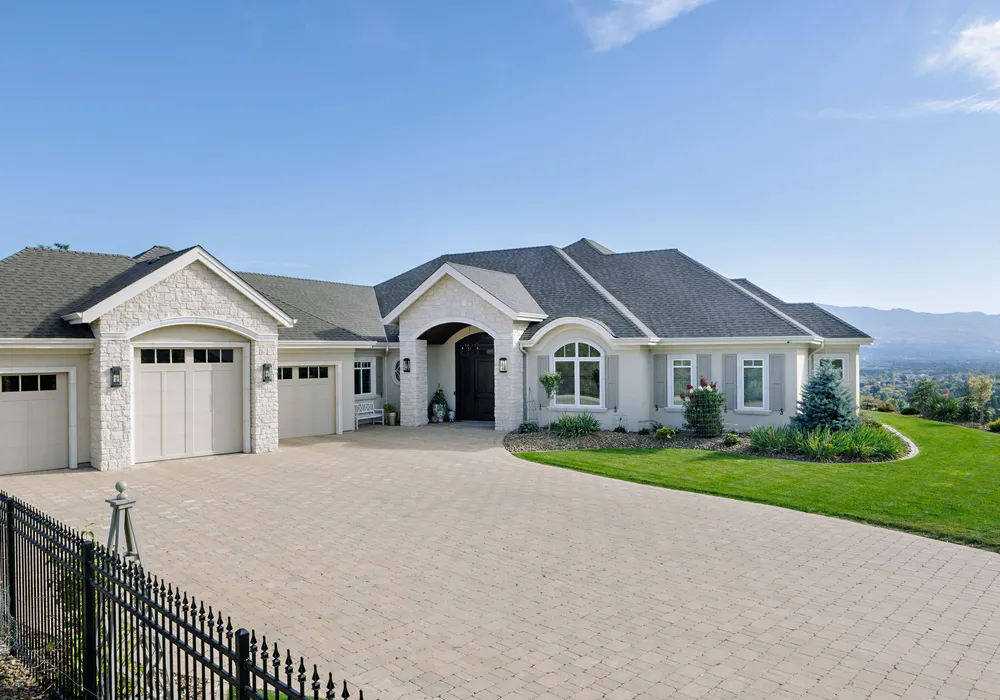 view with home paver stone driveway