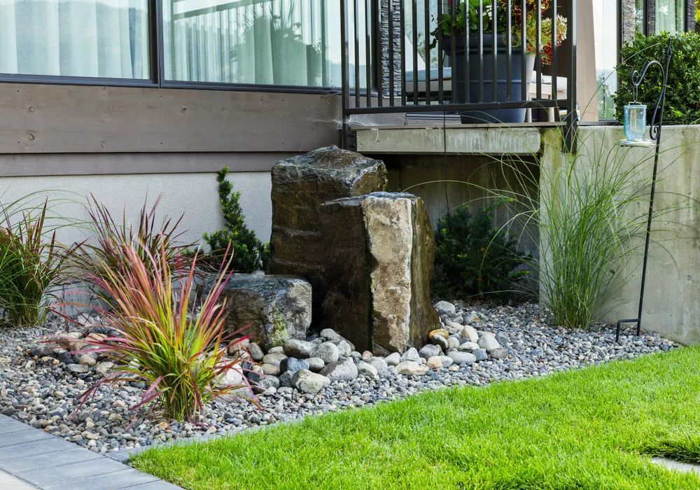 water feature stone grass green
