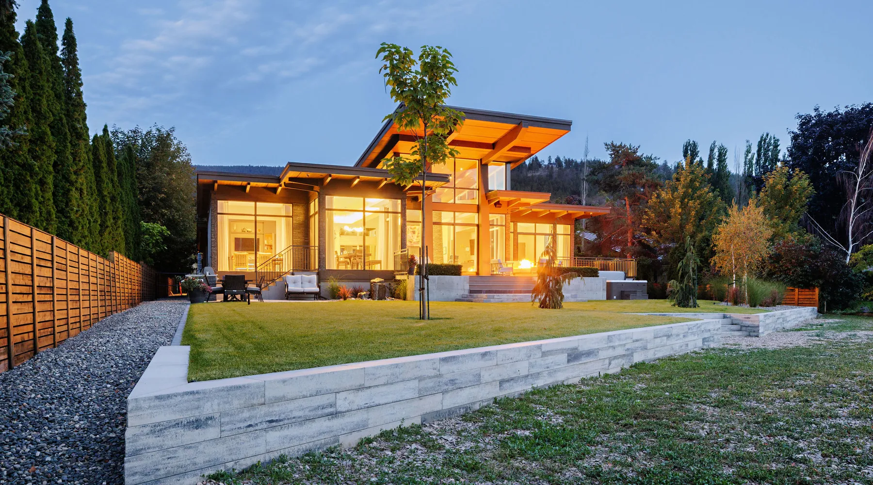 modern home retaining walls and grass with tree